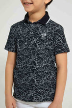 تنزيل الصورة على معرض الصور، Redtag-Black-Splat-Print-Short-Sleeve-Polo-Shirt-Polo-Shirts-Boys-2 to 8 Years