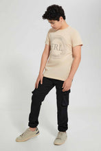 تنزيل الصورة على معرض الصور، Redtag-Beige-Fearless-T-Shirt-Graphic-T-Shirts-Senior-Boys-9 to 14 Years