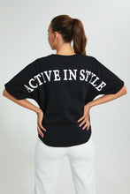 تنزيل الصورة على معرض الصور، بلوزة رياضية باللون الأسود