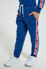 تنزيل الصورة على معرض الصور، Redtag-Blue-Superman-Hooded-Jogsuit-Jog-Sets-Boys-2 to 8 Years
