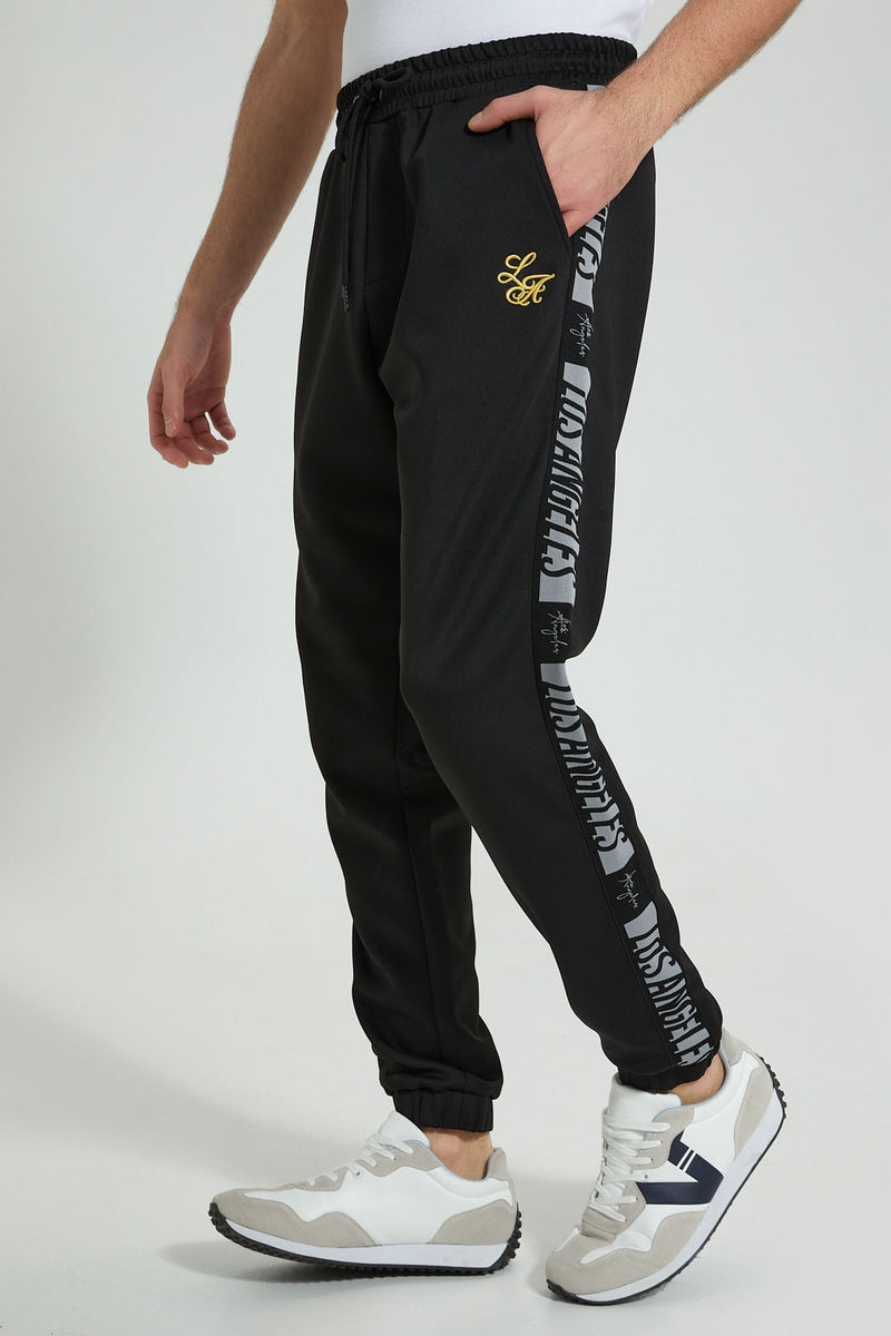 Redtag-Black-Jogger-With-Gold-Signature-Colour:Black,-Filter:Men's-Clothing,-Men-Joggers,-New-In,-New-In-Men,-Non-Sale,-S22B,-Section:Men-Men's-