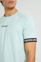 تنزيل الصورة على معرض الصور، Redtag-Green-Stretch-T-Shirt-With-Cuff-Tape-Graphic-Prints-Men&#39;s-
