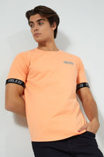 Load image into Gallery viewer, Redtag-Orange-Stretch-T-Shirt-With-Cuff-Tape-Graphic-Prints-Men&#39;s-
