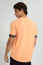 Load image into Gallery viewer, Redtag-Orange-Stretch-T-Shirt-With-Cuff-Tape-Graphic-Prints-Men&#39;s-
