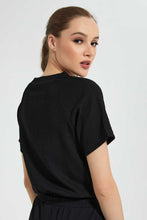 تنزيل الصورة على معرض الصور، Redtag-Black--T-Shirt-With-Waist-Detail-Graphic-T-Shirts-Women&#39;s-
