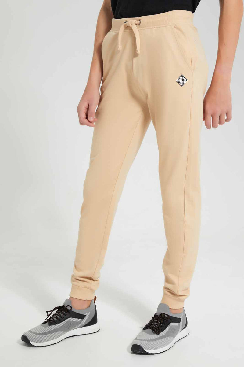 Redtag-Beige-Table-Active-Pant-BSR-Joggers,-Category:Joggers,-Colour:Beige,-Filter:Senior-Boys-(9-to-14-Yrs),-New-In,-New-In-BSR-APL,-Non-Sale,-RMD-add,-S22C,-Section:Kidswear,-TBL--