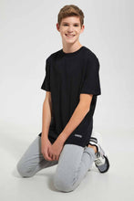 Load image into Gallery viewer, Redtag-Black-Plain-Keyshape-T-Shirt-Plain-T-Shirts-Senior-Boys-9 to 14 Years
