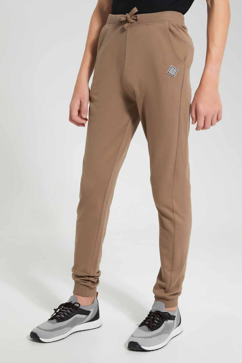 Redtag-Brown-Table-Active-Pants-BSR-Joggers,-Category:Joggers,-Colour:Brown,-Filter:Senior-Boys-(9-to-14-Yrs),-New-In,-New-In-BSR,-Non-Sale,-S22D,-Section:Kidswear,-TBL--