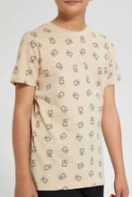 تنزيل الصورة على معرض الصور، Redtag-Beige-Allover-Print-T-Shirt-Graphic-T-Shirts-Senior-Boys-9 to 14 Years
